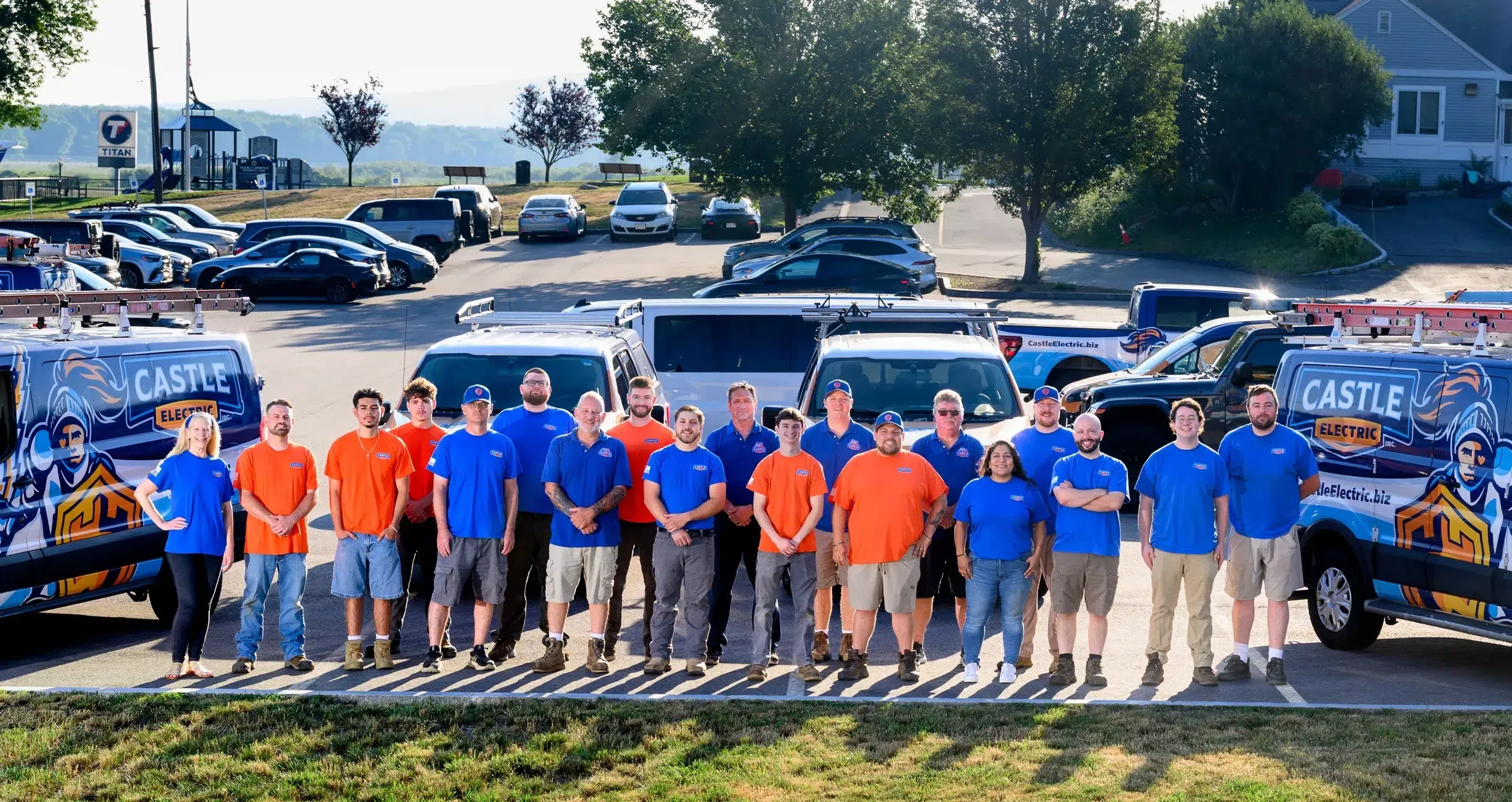 Castle Electric team in front of service vehicle fleet serving Eastern Massachusetts and Greater Boston