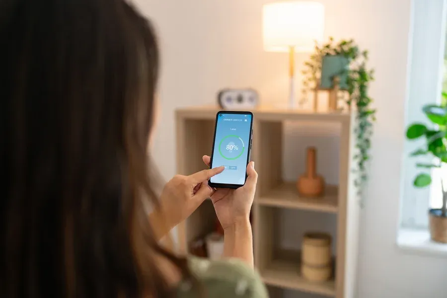 Homeowner uses smart lighting controls with mobile app automation in Newton Home after Castle Electric installation
