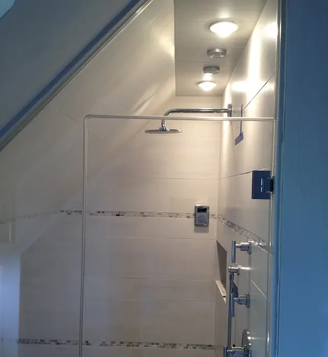 Recessed lighting installation in vaulted bathroom ceiling by Castle Electric in Eastern Massachusetts