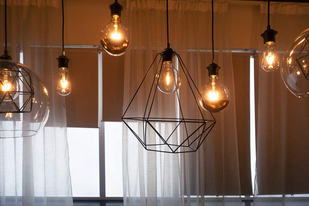 Light bulbs hanging from ceiling with Modern dining room