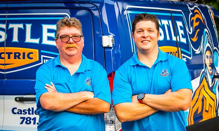 Castle Electric Inc. owners standing in front of branded service van serving Newton and Norwood MA