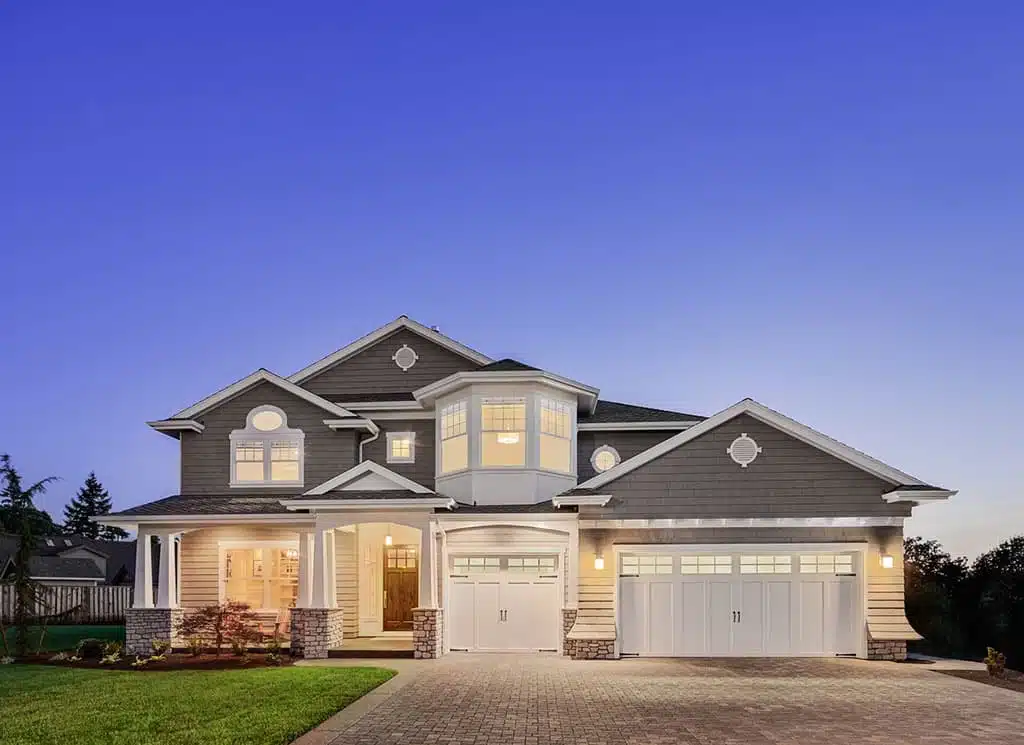 outdoor front view of Newton home lit up at dusk