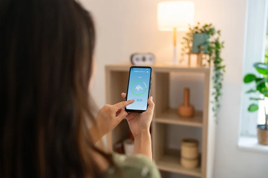 Homeowner uses smart lighting controls with mobile app automation in Newton Home after Castle Electric installation