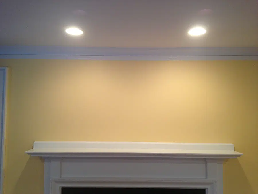 Recessed can lighting above fireplace mantel installed by Castle Electric serving Newton and Norwood MA